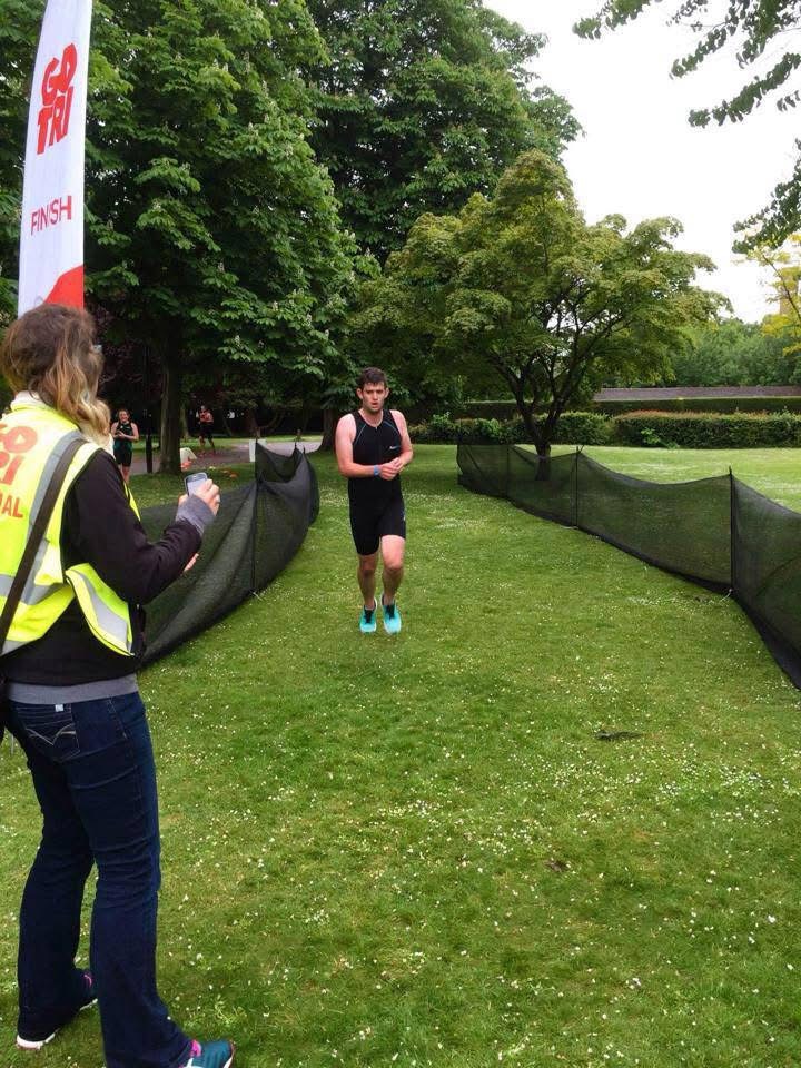 James finishing his first ever Triathlon in Woking Park.