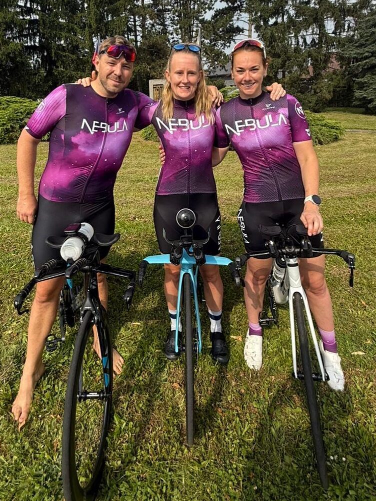 Head Coach Laura, celebrating with coached athletes and Nebula Triathlon Community members post their achievements in 70.3 Czech